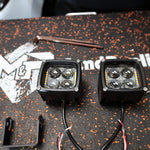 Dual color Ford Maverick Ditch Lights 2025+ LED pods with amber DRL backglow on install bench