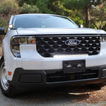 ford maverick light bar 23in curved slim grille mount on white 2025 Ford Maverick XL truck front view on forest road