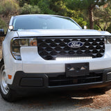 ford maverick light bar 23in curved slim grille mount on white 2025 Ford Maverick XL truck front view on forest road