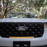 ford maverick light bar 23in installed on 2025 Ford Maverick grille, slim curved amber LED light bar glowing on front bumper