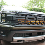 gray ford ranger raptor behind grille LED amber light bar