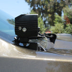 Close-up of 2024 Ford Ranger Raptor hood mount LED light with dual function white and amber DRL backglow.