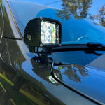 2024 Ford Ranger Raptor hood mount ditch light showcasing bright LED and amber backglow for enhanced aesthetics.