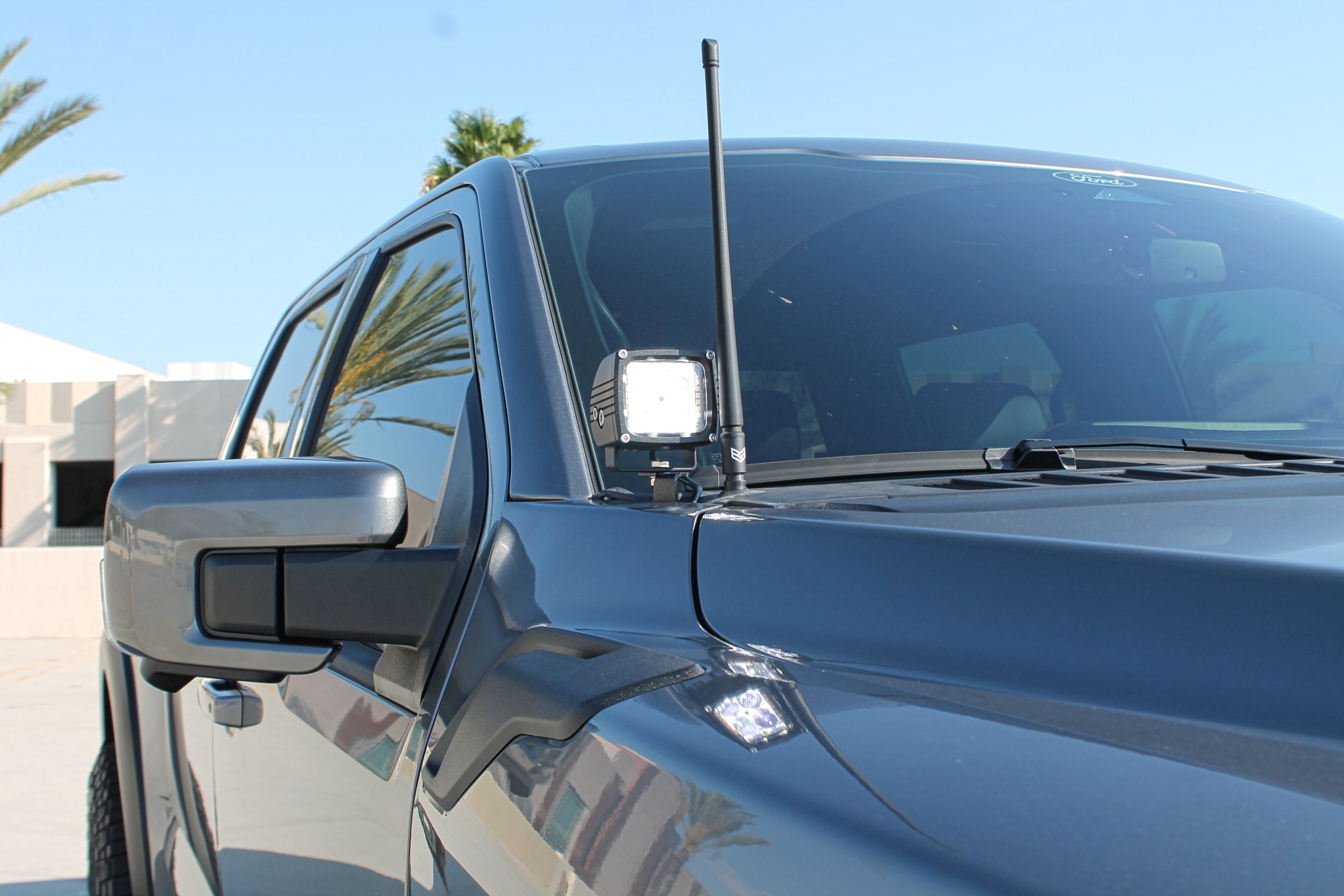 2024+ Ford Raptor ditch lights Gen 3 Refresh A-Pillars on a blue pickup – 2024+ Ford Raptor ditch lights