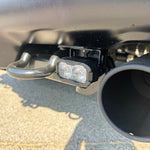 Ford Raptor Gen 3 reverse kit installed on 2024+ Refresh — dual LED reverse lights with bumper hook and exhaust nearby