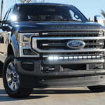 Ford Super Duty ditch lights on a chrome-front F-Series pickup truck