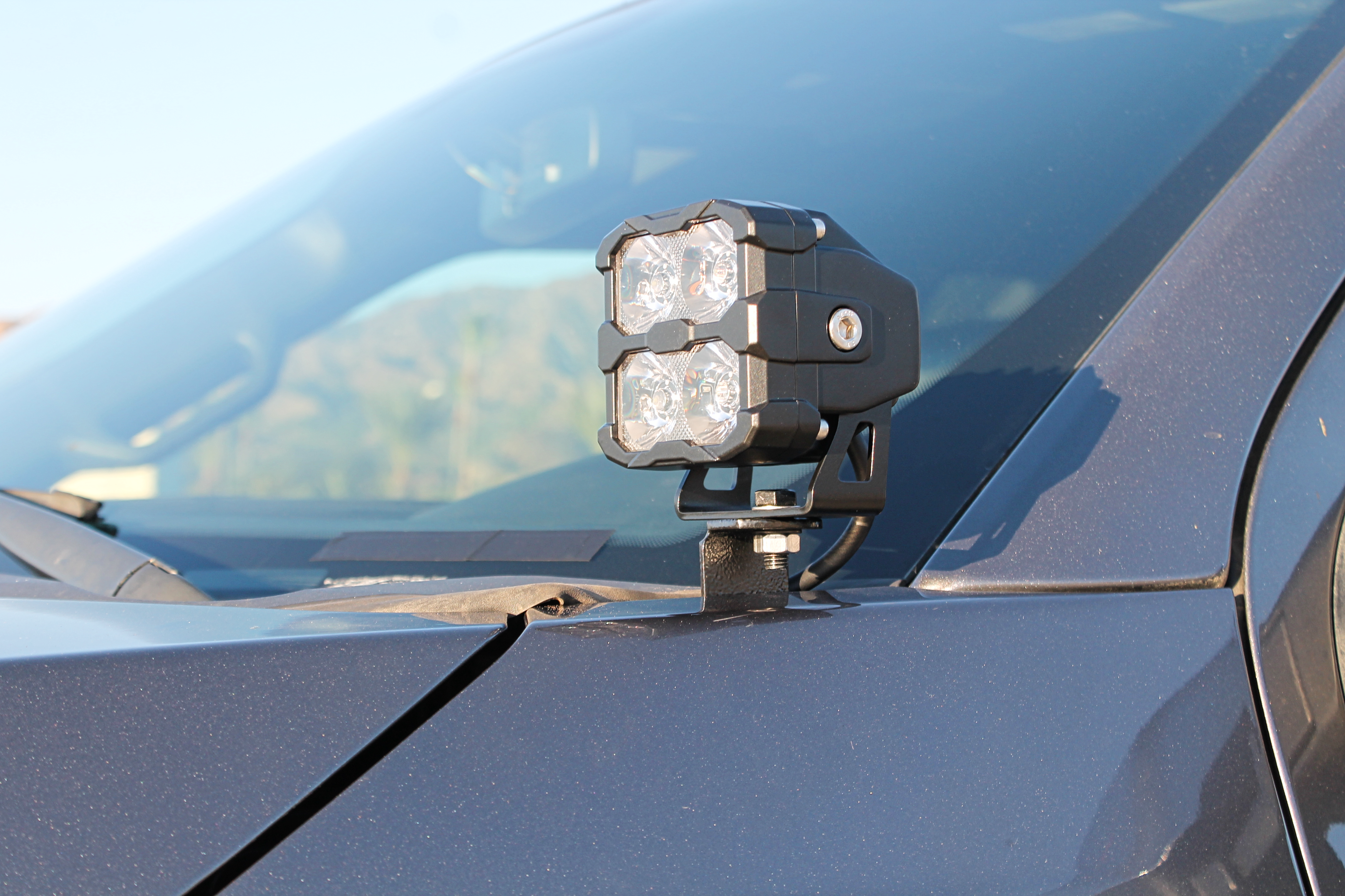 Ford Super Duty Ditch Lights PRO mounted on 2023+ F250/350/450 driver side cowl for enhanced off-road side lighting