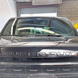 Ford Super Duty Ditch Lights installed on black 2023 Ford Super Duty F250 front view in garage