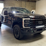 Ford Super Duty Ditch Lights PRO installed on 2023 Ford Super Duty F250 truck front view in garage