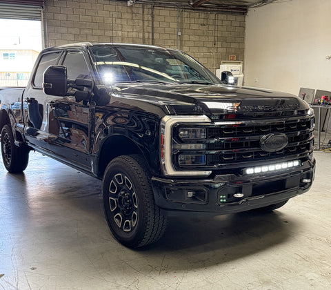 Ford Super Duty Ditch Lights PRO installed on 2023 Ford Super Duty F250 truck front view in garage
