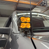 Ford Super Duty Ditch Lights PRO 2023+ F250/350/450 mounted on mirror with amber LED pods illuminated