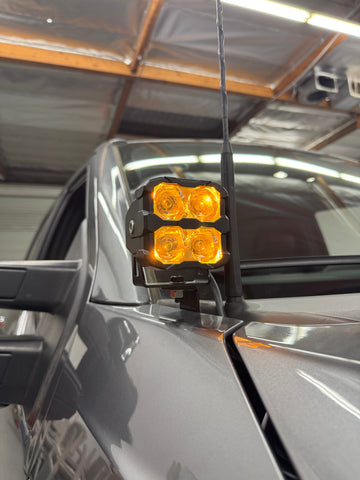 Ford Super Duty Ditch Lights PRO 2023+ F250/350/450 mounted on mirror with amber LED pods illuminated