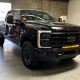 Ford Super Duty Ditch Lights PRO 2023+ F250/350/450 installed on black Ford Super Duty pickup in garage