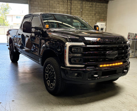 Ford Super Duty Ditch Lights PRO 2023+ F250/350/450 installed on black Ford Super Duty pickup in garage