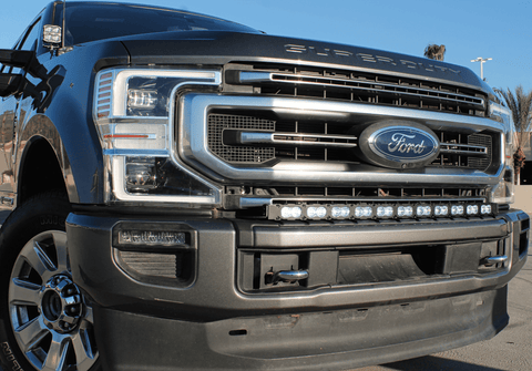 Ford Super Duty light bar on 2020-2022 F250/F350/F450 front grille - Ford badge, chrome bumper, low angle shot