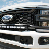 white 2023 2024 ford superduty with 40in curved LED light bar on top of bumper 