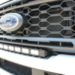 sleek design, curved LED light bar, up close view white LED light bar on a white 2023 ford superduty 