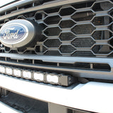 sleek design, curved LED light bar, up close view white LED light bar on a white 2023 ford superduty 