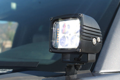 Ford Super Duty ditch lights on 2020-2022 F250/F350/F450 — rugged auxiliary LED spotlight mounted on windshield, off-road ready