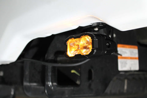 Ford Super Duty reverse light - forward-facing under-vehicle view showing orange flood-style pod light for 2020-2022 F250/F350/F450 with pair kit