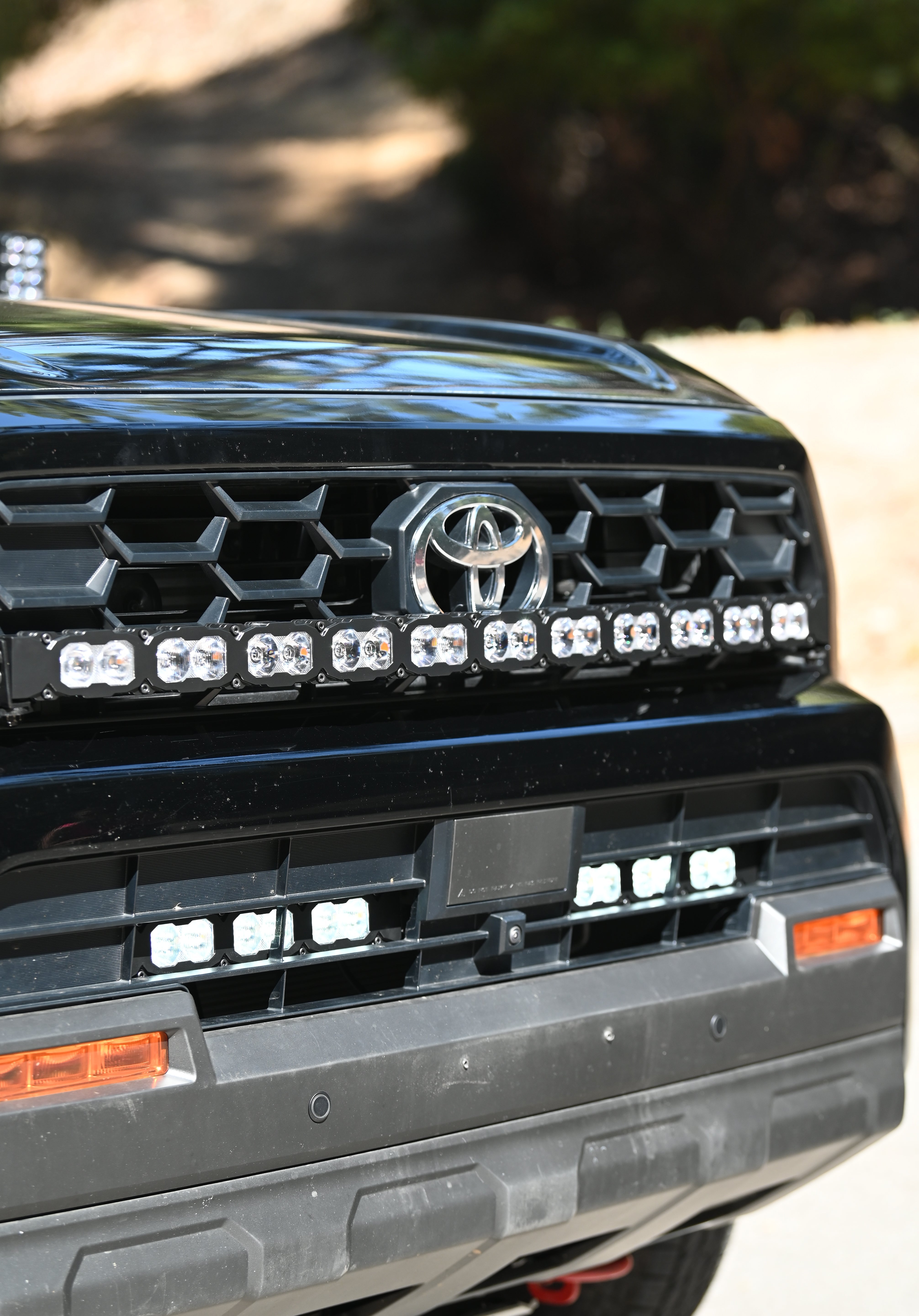 4Runner Light Bar installed on front grille of black 2025 Toyota 4Runner TRD, curved 40in LED light bar PRO close-up