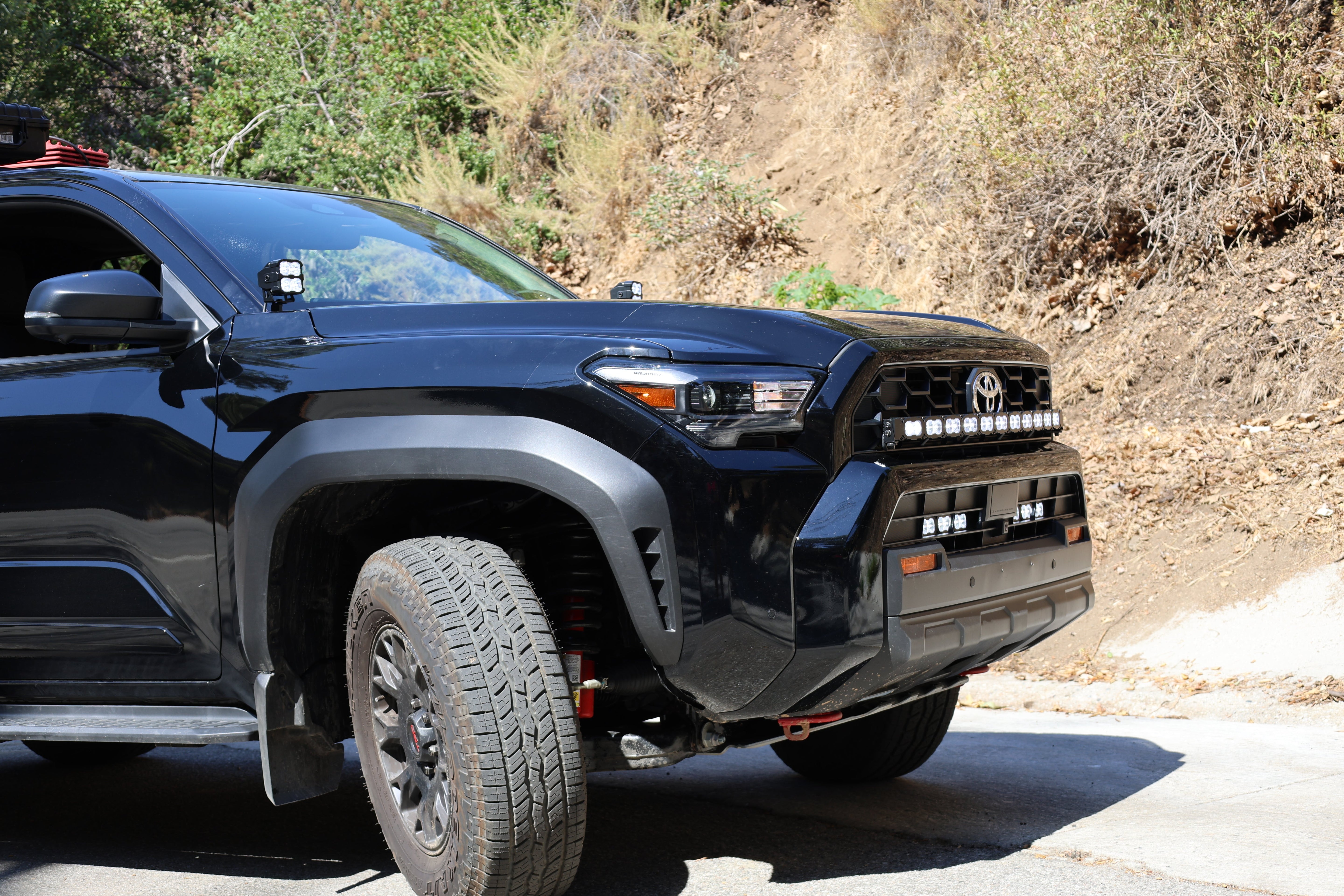 4Runner Light Bar PRO 40in curved LED grille light bar on 2025 Toyota 4Runner TRD Off-Road parked on mountain road
