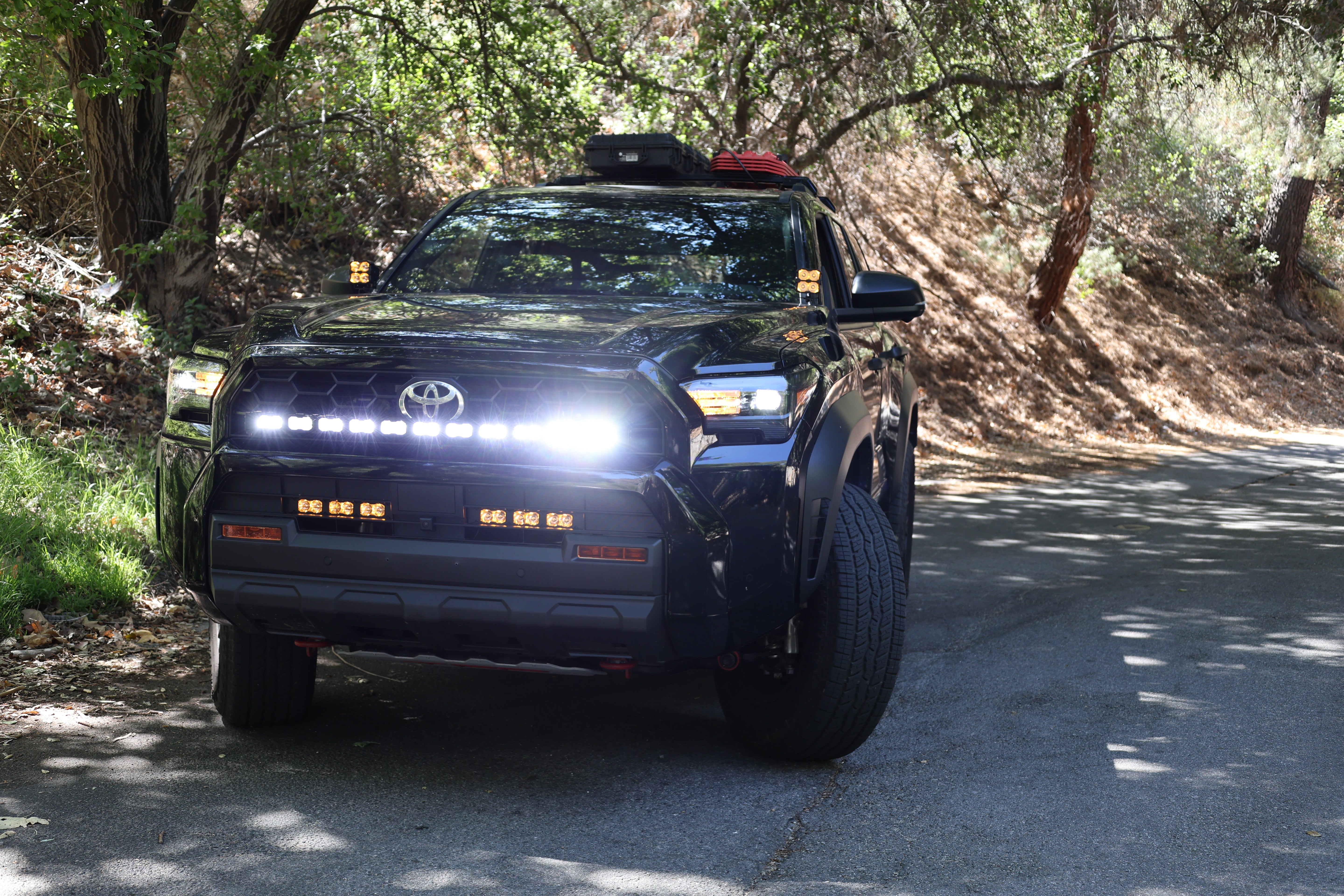 4Runner Light Bar on black 2025 Toyota 4Runner PRO curved 40in LED grille mount lighting on forest road