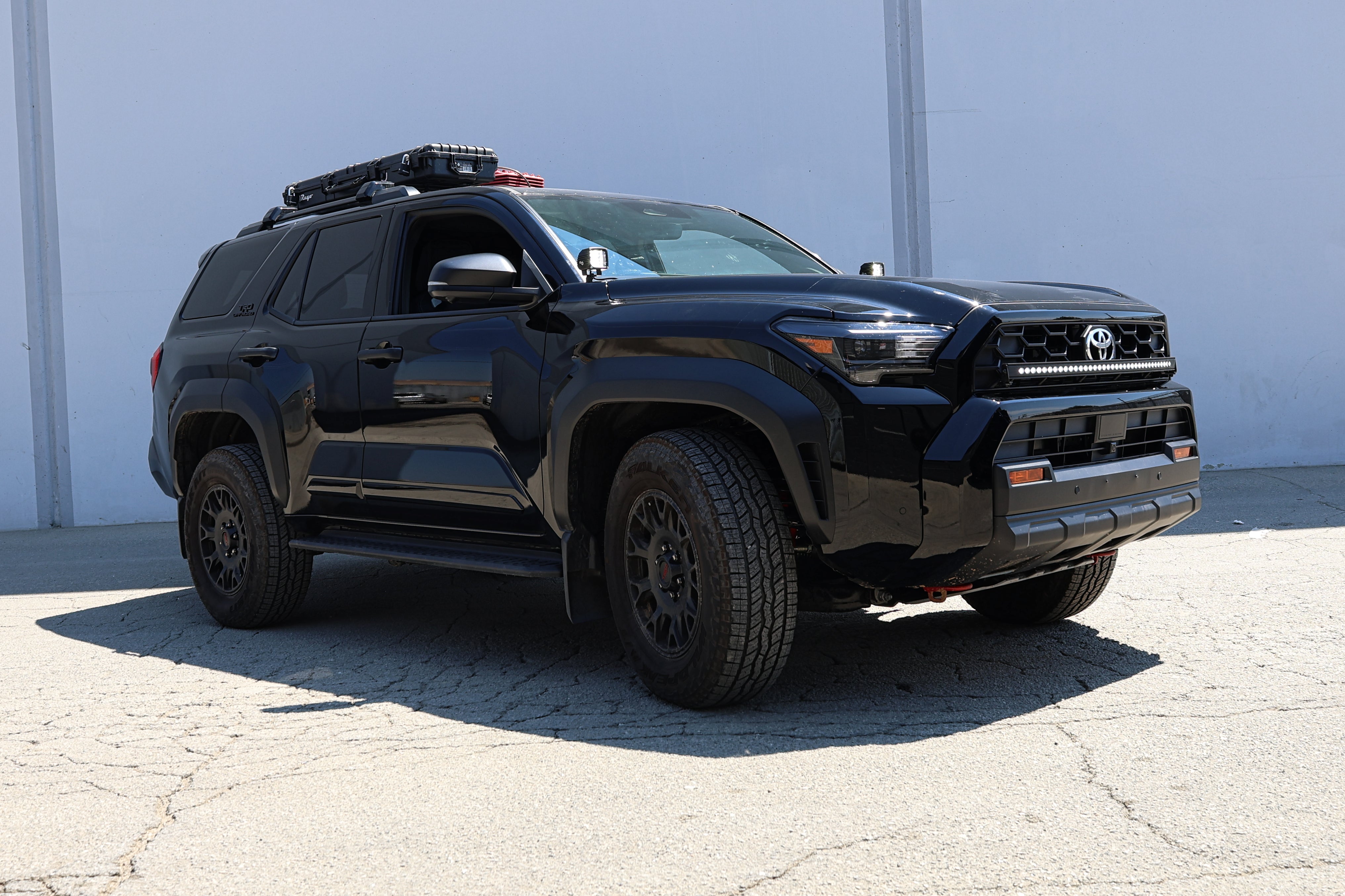4Runner Light Bar on black 2025 Toyota 4Runner with 40in curved slim LED light bar mounted in front of grille