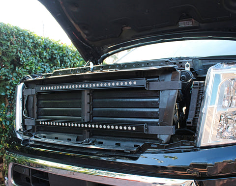 nissan titan grille off showing two led light bars and metal brackets for off roading