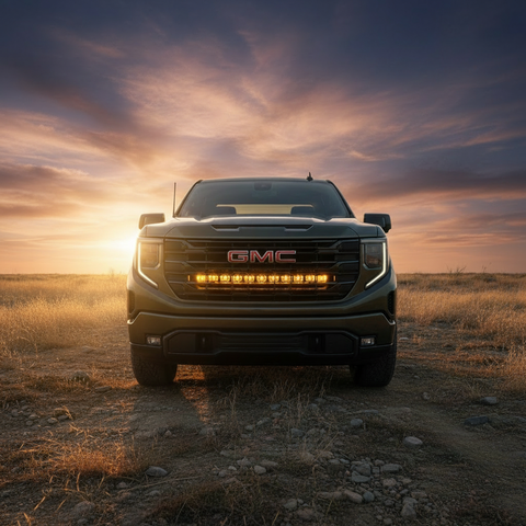2026+ GMC Sierra 1500 Light Bar PRO single 40in LED mounted on front grille in off-road desert at sunset
