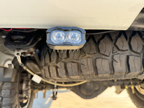 Sierra HD Reverse kit pod pair on GMC Sierra 2500/3500 HD with white LEDs and amber or red backlight option, fits 2020-2026 models