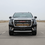 2021-2024 GMC Yukon with a single 40in SLIM light bar installed on the grille, showcasing its sleek front view.