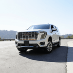 2025 2026 GMC Yukon with Dual 40s Slim Light Bars mounted under GMC grille on highway