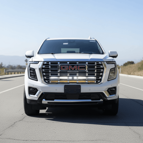 2025 2026 GMC Yukon front view with dual 40s slim LED light bars mounted under GMC grille logo