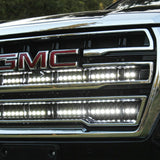 2021 2022 2023 2024 silver gmc yukon with two white 40in light bars behind the grille