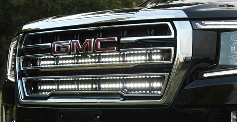 2021 2022 2023 2024 silver gmc yukon with two white 40in light bars behind the grille