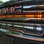 2021 2022 2023 2024 silver gmc yukon with two 40in light bars behind the grille color white and amber