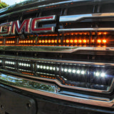 2021 2022 2023 2024 silver gmc yukon with two 40in light bars behind the grille color white and amber