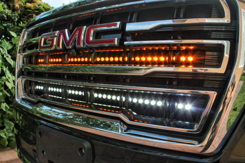 2021 2022 2023 2024 silver gmc yukon with two 40in light bars behind the grille color white and amber