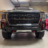 GMC Yukon LightBar 2021-2024 GMC Yukon front view with PRO light bars behind grille, fits SLE SLT AT4 Denali trims; must remove grille, no cutting; GMC logo area