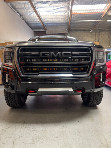 GMC Yukon LightBar 2021-2024 GMC Yukon front view with PRO light bars behind grille, fits SLE SLT AT4 Denali trims; must remove grille, no cutting; GMC logo area