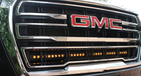 2023 2024 silver gm canyon with one amber 40in light bar behind the grille