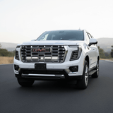 2025 2026 GMC Yukon with dual 40s slim light bars mounted under GMC grille logo on front bumper