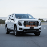 2025 2026 GMC Yukon with slim dual 40s light bars mounted under GMC grille on front bumper