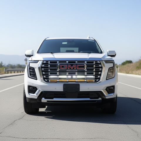 2025 white gmc yukon with light bars behind the grille for off roading