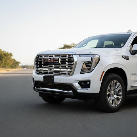 2026 white gmc yukon with led light bars behind grille for off roading