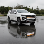 2025+ Chevrolet Suburban with dual 40s light bars reflecting in the wet pavement, showcasing Suburban Light Bars.