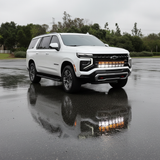 2025+ Chevrolet Suburban with dual 40s light bars reflecting in the wet pavement, showcasing Suburban Light Bars.