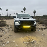 2025+ RAM 1500 RHO 23in PRO curved LED light bar mounted between grille and bumper
