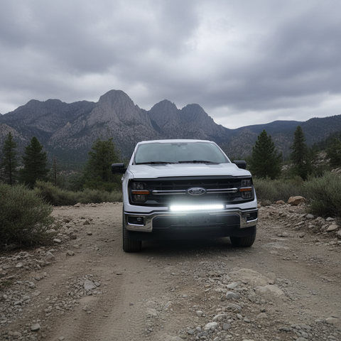 2024+ Ford F150 LightBar installed on a 2024 Ford F150, off-road setting with mountains in the background.